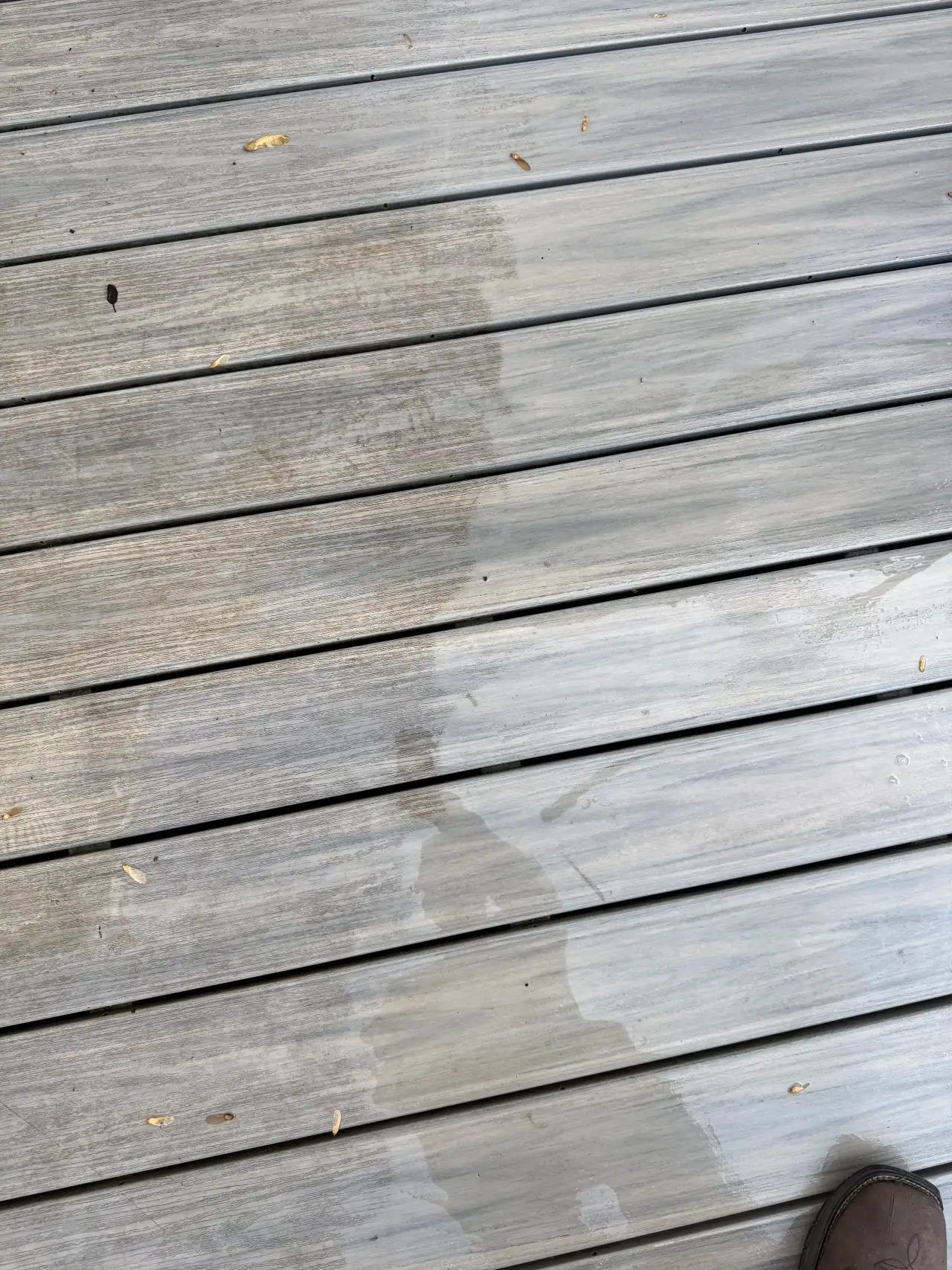 A cleaned wood deck restored to its natural color